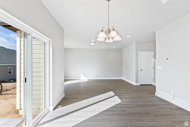 1749 S Sageberry Dr Unit 350, Santaquin, UT 84655 - unfurnished dining area featuring wood finished floors, a chandelier, baseboards, and recessed lighting