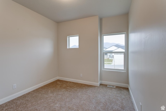 1641 S Windsong Dr Unit 371, Santaquin, UT 84655 - carpeted spare room with plenty of natural light and baseboards