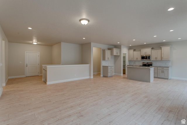 1641 S Windsong Dr Unit 371, Santaquin, UT 84655 - kitchen with appliances with stainless steel finishes, a sink, open floor plan, backsplash, and recessed lighting