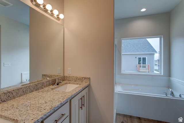1641 S Windsong Dr Unit 371, Santaquin, UT 84655 - full bathroom featuring vanity, a garden tub, recessed lighting, and wood finished floors
