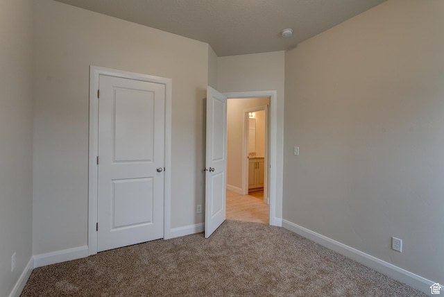 1641 S Windsong Dr Unit 371, Santaquin, UT 84655 - unfurnished bedroom featuring carpet floors and baseboards