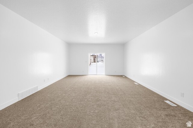 1701 S Windsong Dr Unit 377, Santaquin, UT 84655 - spare room with a textured ceiling and carpet