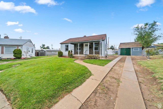 37 N Lakeview Dr, Clearfield, UT 84015 - bungalow featuring driveway, covered porch, and a front lawn