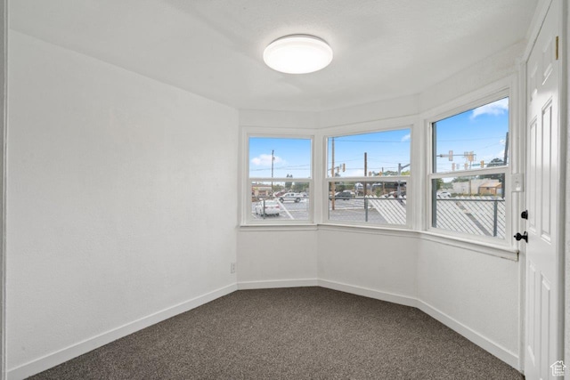 37 N Lakeview Dr, Clearfield, UT 84015 - spare room featuring dark colored carpet and baseboards