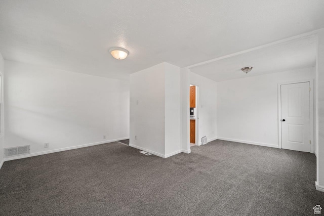 37 N Lakeview Dr, Clearfield, UT 84015 - unfurnished room with dark carpet, baseboards, and visible vents