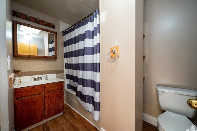 4180 Liberty Ave, South Ogden, UT 84403 - bathroom featuring baseboards, toilet, a textured ceiling, vanity, and wood finished floors