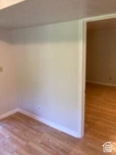 4180 Liberty Ave, South Ogden, UT 84403 - unfurnished room featuring wood finished floors and baseboards