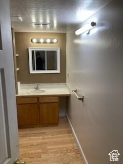 4180 Liberty Ave, South Ogden, UT 84403 - bathroom with vanity and wood finished floors