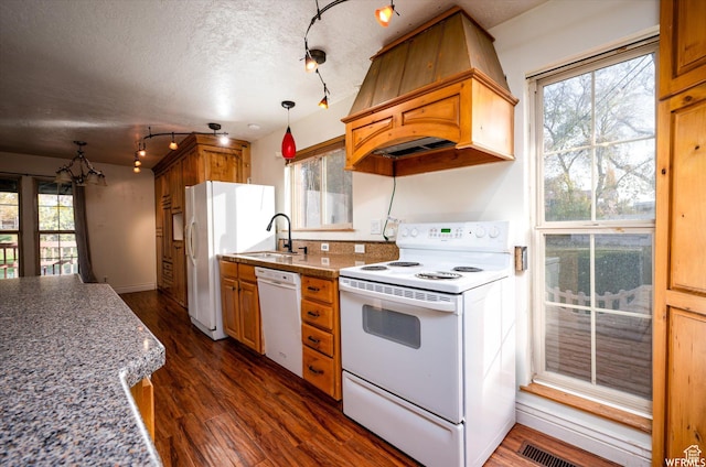 4180 Liberty Ave, South Ogden, UT 84403 - kitchen featuring dark wood finished floors, white appliances, a sink, custom range hood, and a notable chandelier