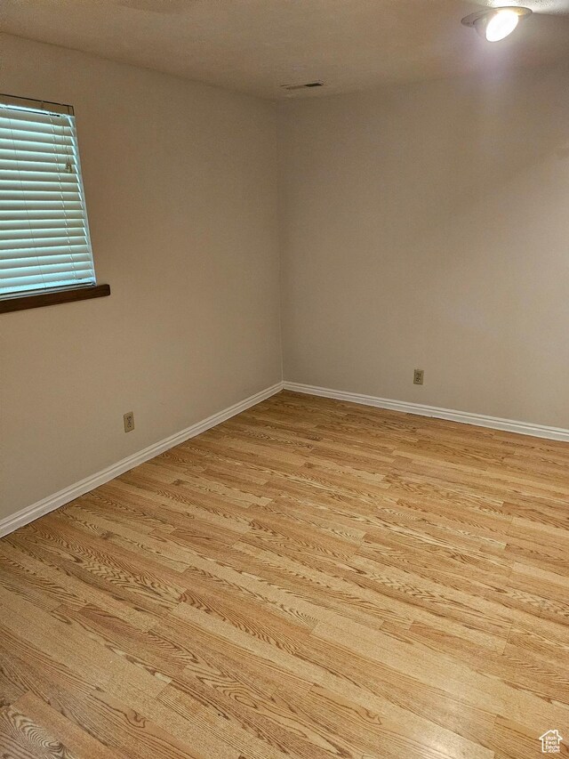 4180 Liberty Ave, South Ogden, UT 84403 - empty room featuring light wood-style flooring and baseboards