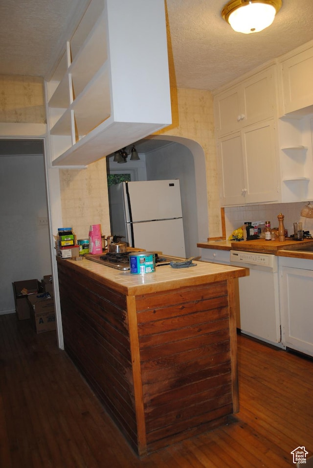 619 E 400 N, Logan, UT 84321 - kitchen with butcher block countertops, open shelves, white appliances, arched walkways, and white cabinets
