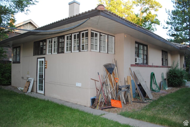 619 E 400 N, Logan, UT 84321 - view of side of home featuring cooling unit and a chimney