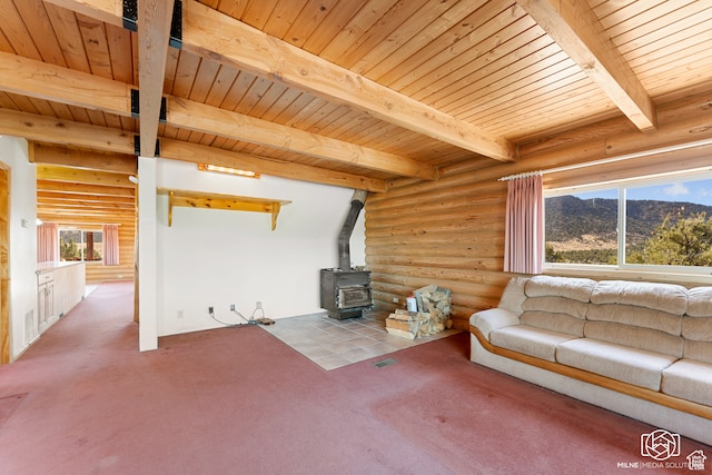 4245 S Artifact Dr, Cedar City, UT 84720 - living room featuring beam ceiling, log walls, a wood stove, wooden ceiling, and a mountain view