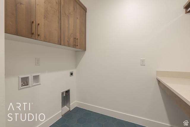 627 S 1800 W, Hurricane, UT 84737 - laundry area with hookup for an electric dryer, hookup for a washing machine, cabinets, and dark tile patterned flooring