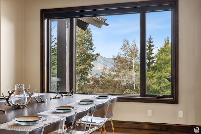 3608 Sun Ridge Dr, Park City, UT 84060 - dining area with a mountain view, wood finished floors, and baseboards