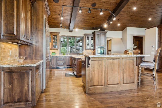 3608 Sun Ridge Dr, Park City, UT 84060 - kitchen featuring wood ceiling, rail lighting, light wood-style flooring, and stainless steel oven