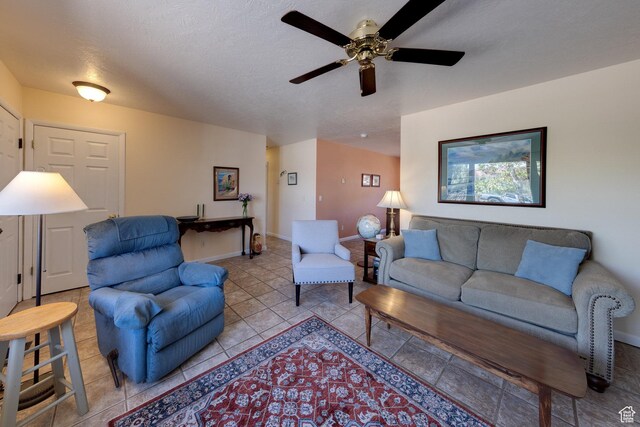 1122 E Holyoak Ln, Moab, UT 84532 - living area featuring baseboards, ceiling fan, and light tile patterned floors