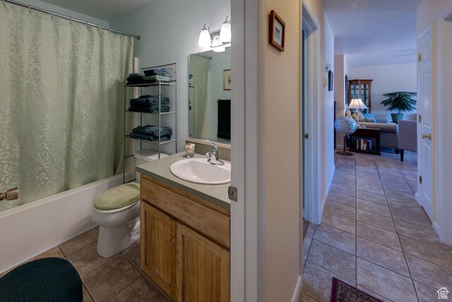 1122 E Holyoak Ln, Moab, UT 84532 - bathroom featuring toilet, shower / bathtub combination with curtain, tile patterned flooring, and vanity