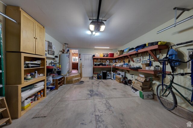 1122 E Holyoak Ln, Moab, UT 84532 - garage featuring water heater and a workshop area