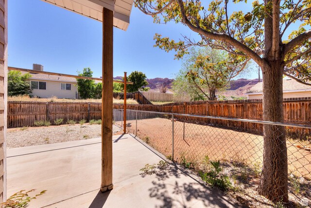 1122 E Holyoak Ln, Moab, UT 84532 - view of patio / terrace with a fenced backyard and a mountain view