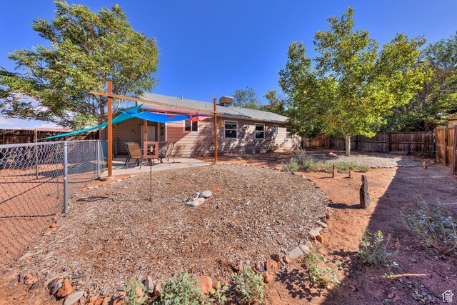 1122 E Holyoak Ln, Moab, UT 84532 - view of yard with a patio and a fenced backyard