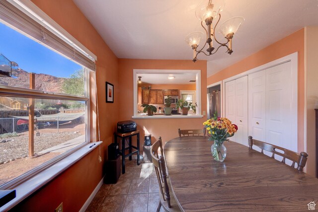 1122 E Holyoak Ln, Moab, UT 84532 - dining space featuring baseboards and a chandelier