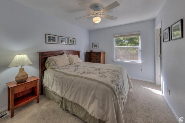 1122 E Holyoak Ln, Moab, UT 84532 - carpeted bedroom featuring a ceiling fan, baseboards, and visible vents