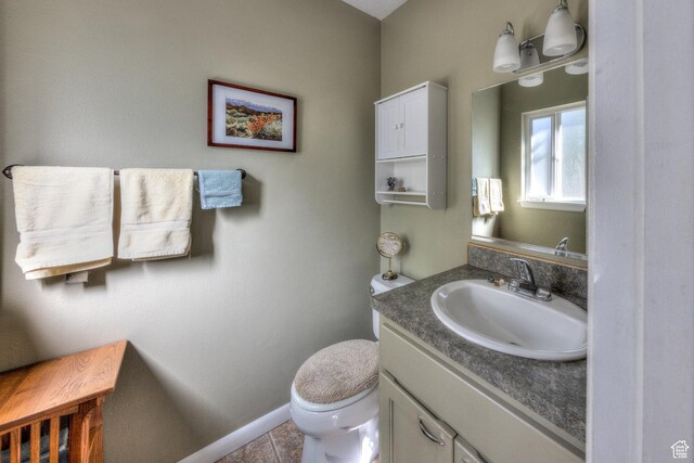 1122 E Holyoak Ln, Moab, UT 84532 - bathroom featuring vanity, baseboards, tile patterned floors, and toilet