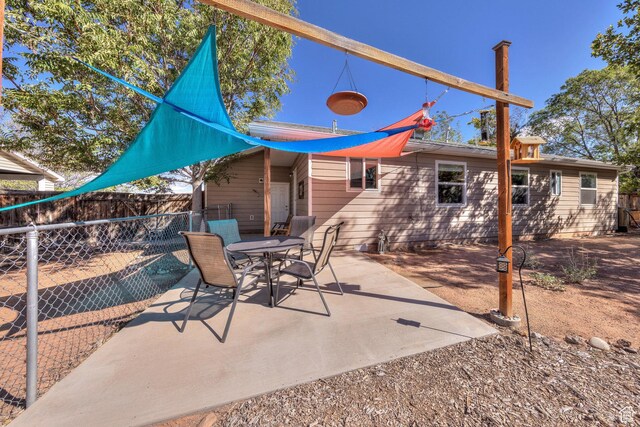 1122 E Holyoak Ln, Moab, UT 84532 - view of patio / terrace featuring outdoor dining area and a fenced backyard