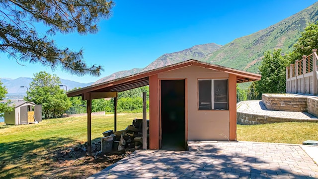 410 S Woodland Hills Dr, Woodland Hills, UT 84653 - exterior space featuring a shed, an outdoor structure, and a mountain view