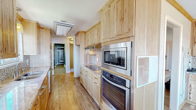 410 S Woodland Hills Dr, Woodland Hills, UT 84653 - kitchen with decorative backsplash, stainless steel appliances, a sink, light wood-type flooring, and light brown cabinetry