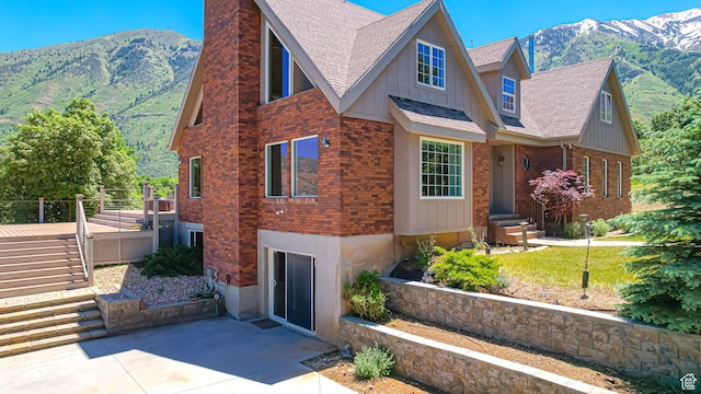 410 S Woodland Hills Dr, Woodland Hills, UT 84653 - view of front of home with a chimney, a mountain view, and roof with shingles