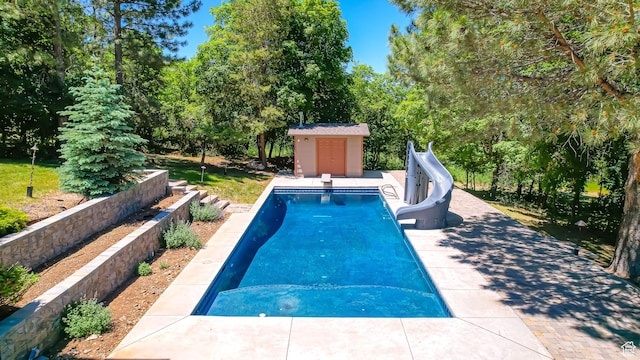 410 S Woodland Hills Dr, Woodland Hills, UT 84653 - view of swimming pool featuring a patio, an outbuilding, a fenced in pool, and a water slide