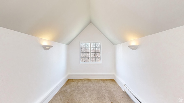 410 S Woodland Hills Dr, Woodland Hills, UT 84653 - additional living space with a baseboard radiator, baseboards, light carpet, a baseboard heating unit, and vaulted ceiling