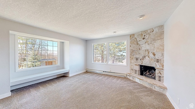 410 S Woodland Hills Dr, Woodland Hills, UT 84653 - unfurnished living room featuring a fireplace, a textured ceiling, baseboards, a baseboard heating unit, and carpet