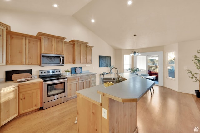 1052 S 350 E, Payson, UT 84651 - kitchen featuring stainless steel appliances, light brown cabinets, a sink, vaulted ceiling, and light wood finished floors