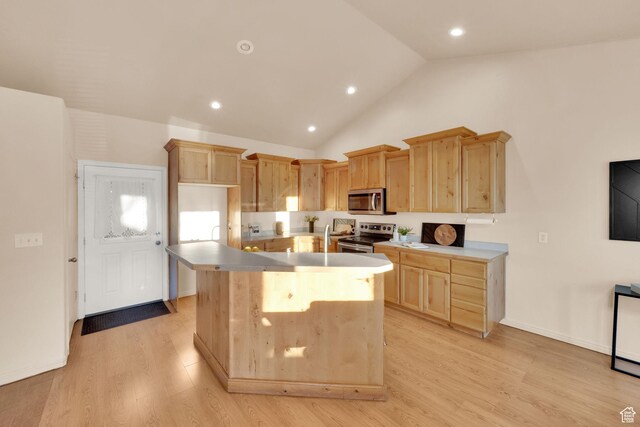 1052 S 350 E, Payson, UT 84651 - kitchen with stainless steel appliances, light brown cabinetry, a center island, light wood-style flooring, and lofted ceiling