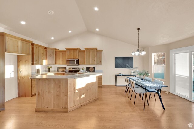 1052 S 350 E, Payson, UT 84651 - kitchen with stainless steel appliances, light brown cabinets, light countertops, a kitchen island with sink, and light wood-type flooring