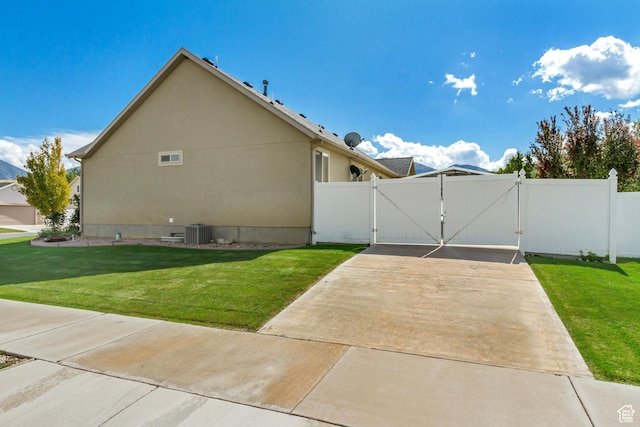 1052 S 350 E, Payson, UT 84651 - view of property exterior featuring a gate and central AC unit