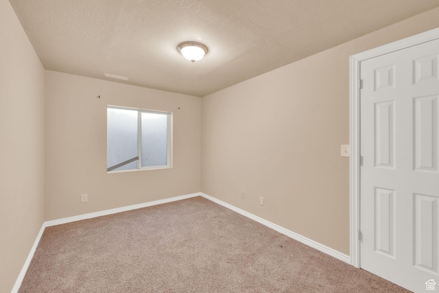 1052 S 350 E, Payson, UT 84651 - empty room featuring carpet flooring, baseboards, and a textured ceiling