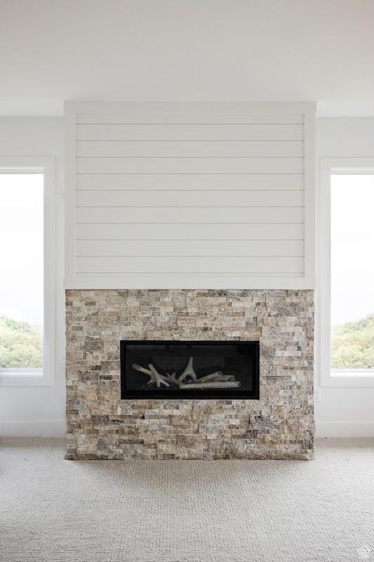 672 Skyview Cir N, Salt Lake, UT 84054 - interior details featuring carpet floors and a fireplace