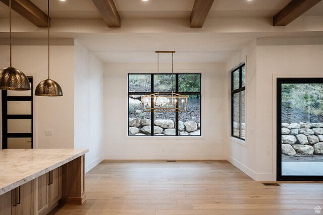 672 Skyview Cir N, Salt Lake, UT 84054 - unfurnished dining area featuring an inviting chandelier, light wood-type flooring, and beam ceiling