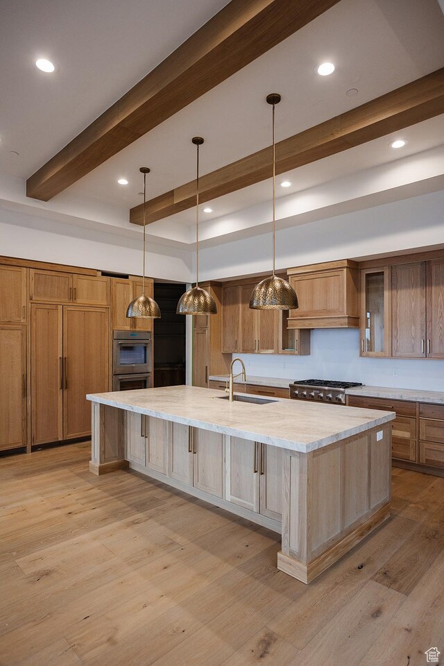 672 Skyview Cir N, Salt Lake, UT 84054 - kitchen featuring light hardwood / wood-style floors, a large island, beamed ceiling, and sink