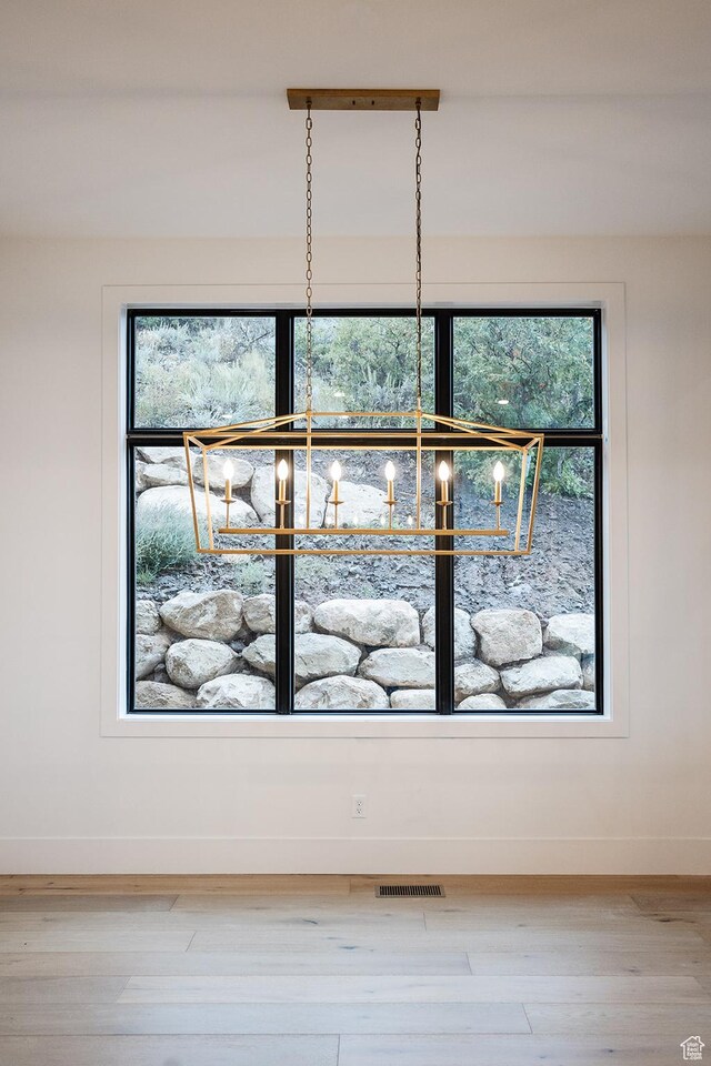 672 Skyview Cir N, Salt Lake, UT 84054 - interior details featuring wood-type flooring and an inviting chandelier