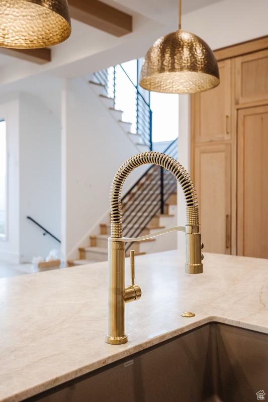 672 Skyview Cir N, Salt Lake, UT 84054 - interior details featuring light stone counters, decorative light fixtures, and sink