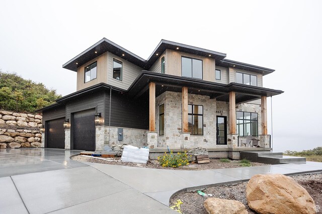 672 Skyview Cir N, Salt Lake, UT 84054 - view of front of house with a porch and a garage