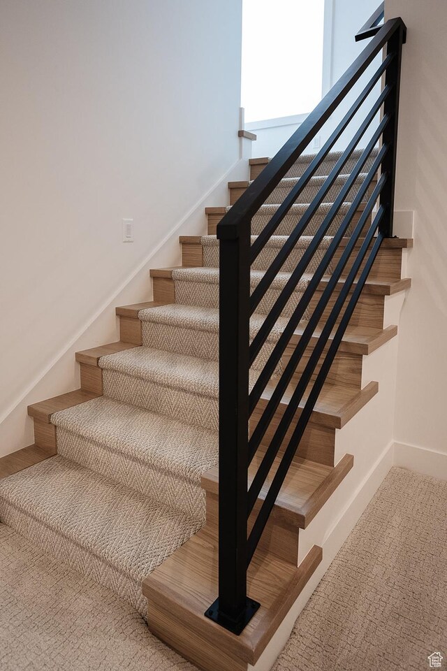 672 Skyview Cir N, Salt Lake, UT 84054 - stairs with carpet flooring