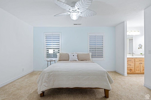 bedroom with a ceiling fan, baseboards, light colored carpet, and visible vents