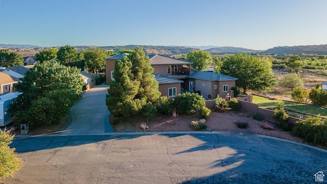 birds eye view of property with a mountain view
