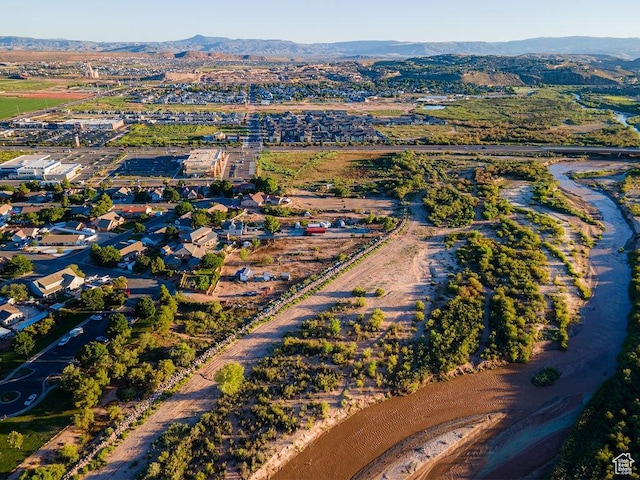 birds eye view of property with a mountain view